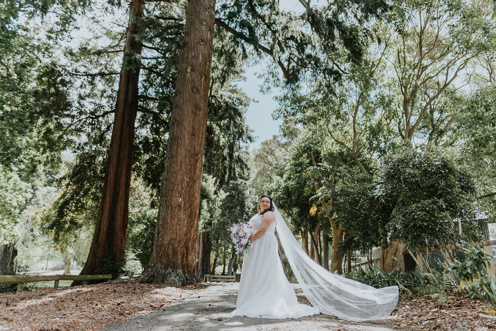 Newbury Hall wedding photography of Jamilah as she poses in the forest